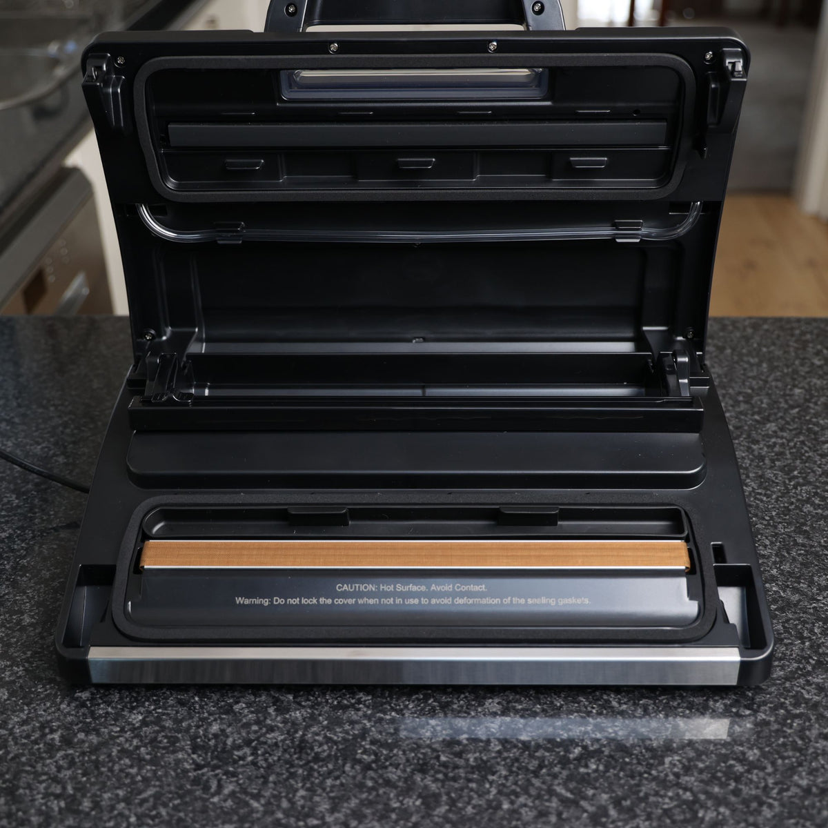 Liquid Ready Vacuum Sealer Lid Open showing heat seal bar, drip tray, roll holder and cutter, airhose tube and foam seals / gaskets